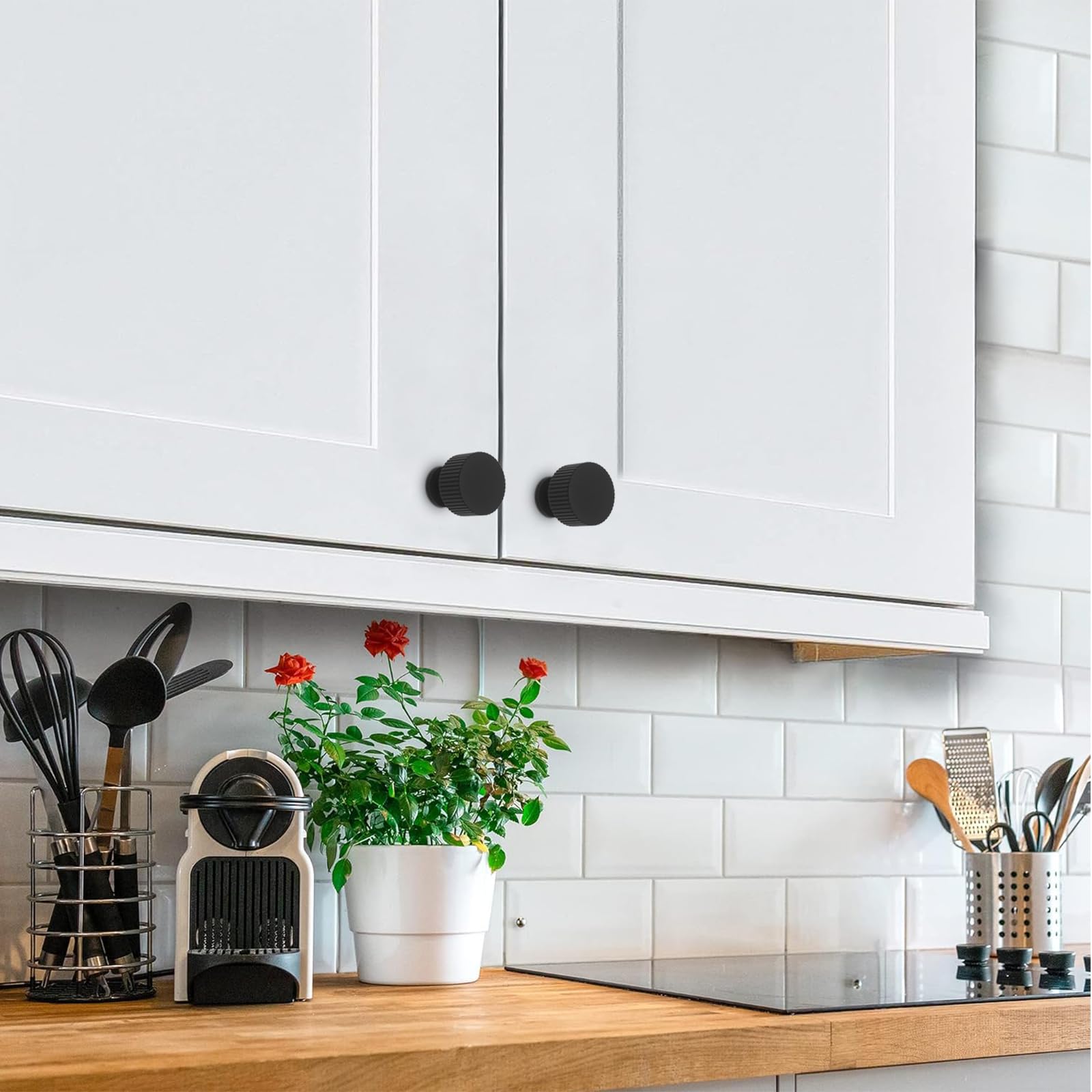 Abtopia matte-black knob close-up featuring a cylindrical vertical stripe design.
