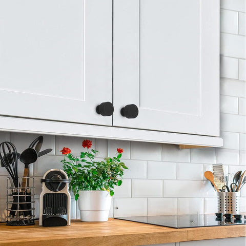 Abtopia matte-black knob close-up featuring a cylindrical vertical stripe design.