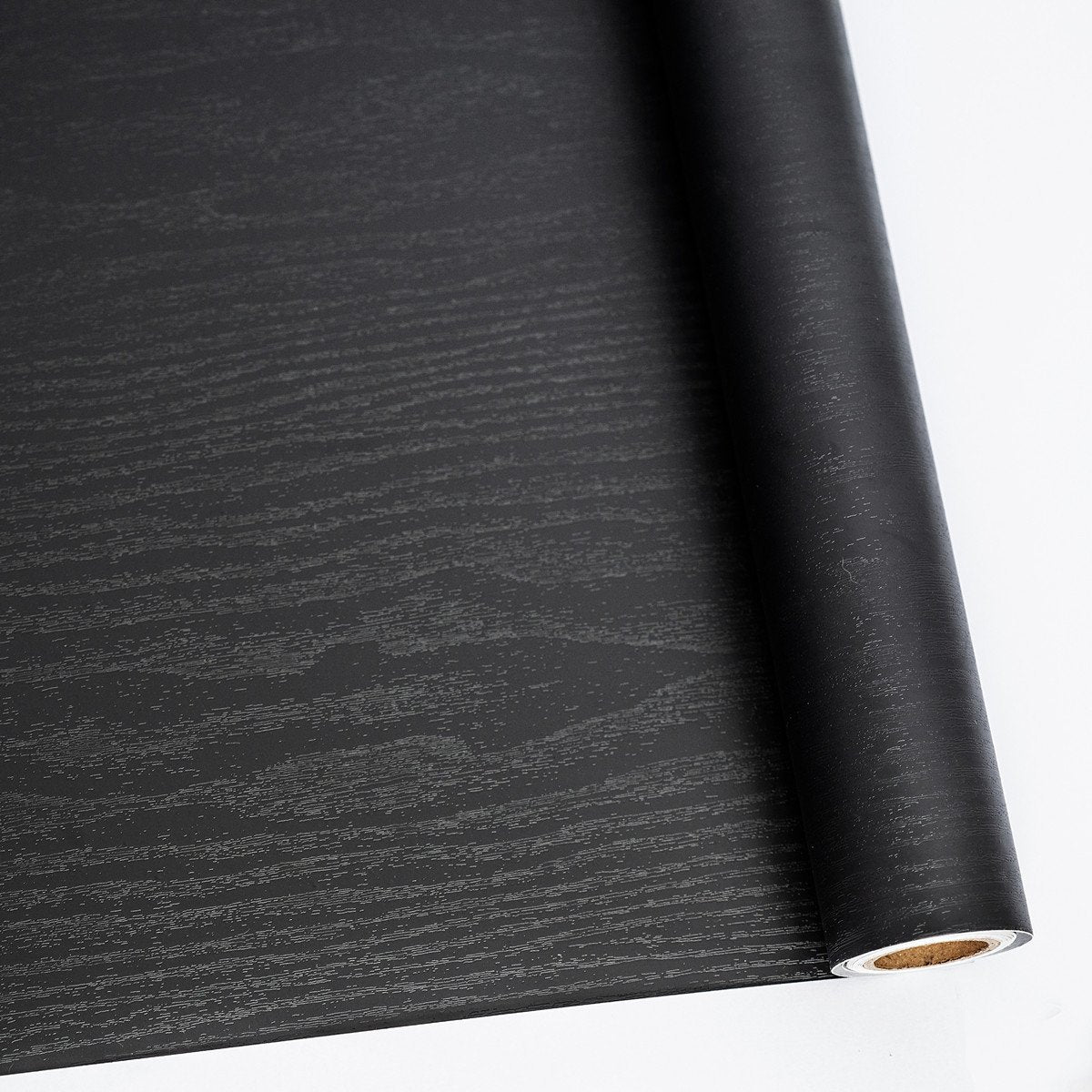 Abyssaly black wood wallpaper roll adds authentic texture to furniture surfaces and hides wear