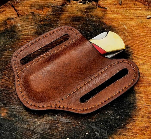 ADAM KNIVES trapper style sheath keeps knife secure during outdoor use.