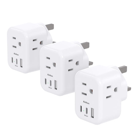 Addtam Type G travel plug front view with 3 outlets and 3 USB ports for simultaneous charging