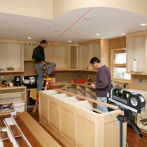 AikTryee laser level tool in use on wall with cabinets for precise layouts