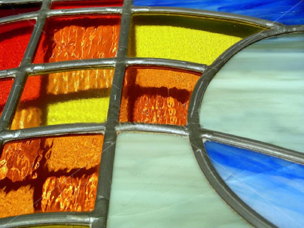 AIM Artist Pure 50/50 solder on a stained glass workbench ensures reliable repairs.