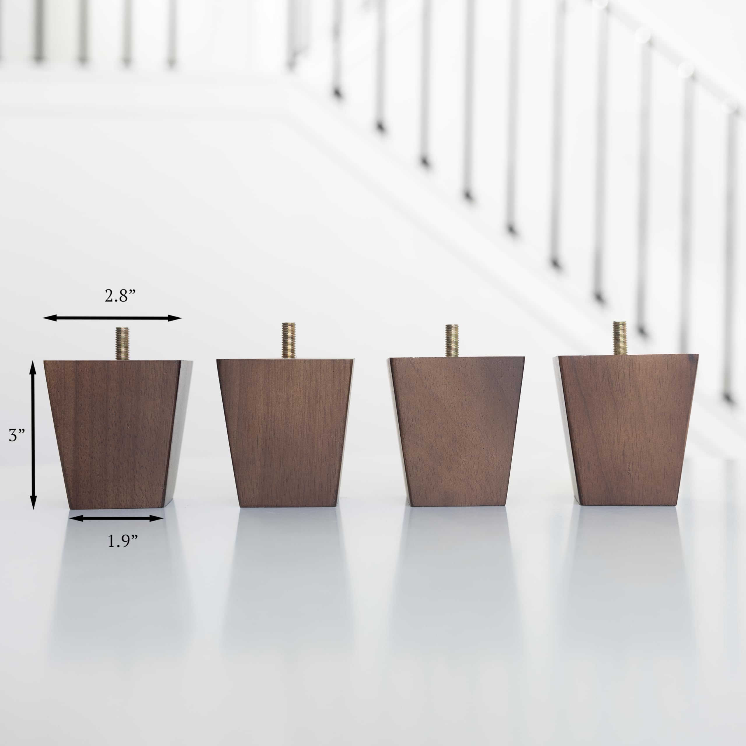 Airy Abode felt floor protectors attached to walnut legs in use