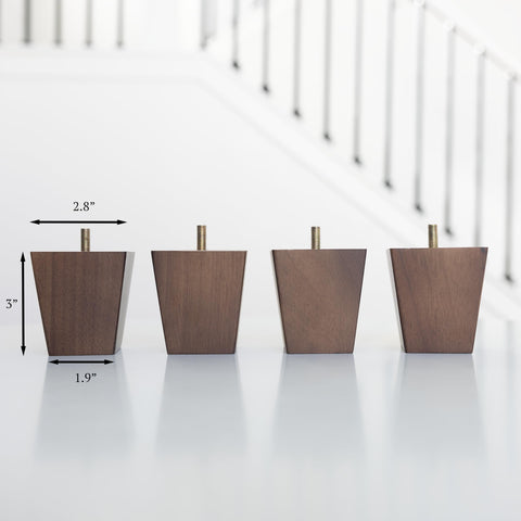 Airy Abode felt floor protectors attached to walnut legs in use