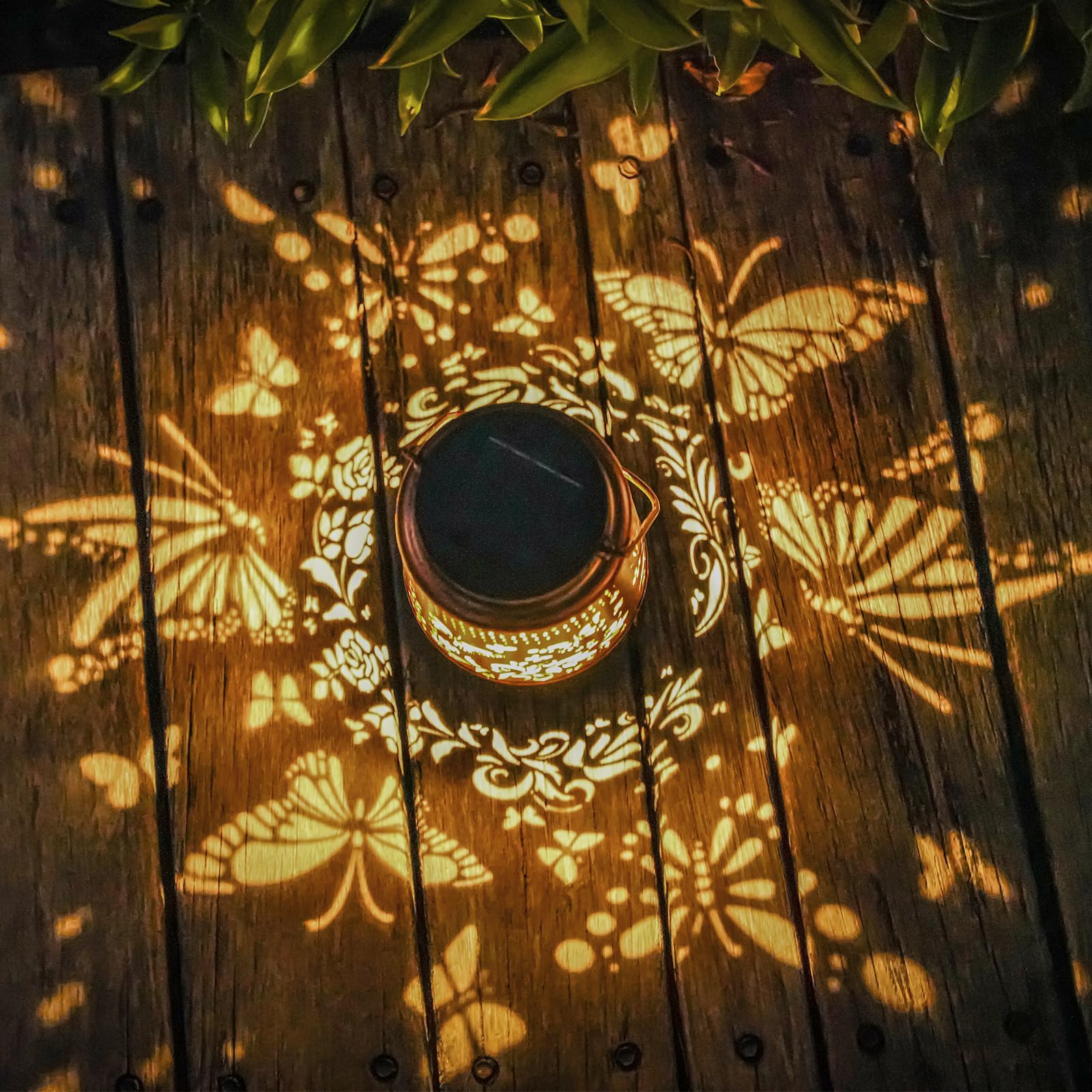 AITENISEN metal lantern with gold copper finish enhances garden aesthetics.