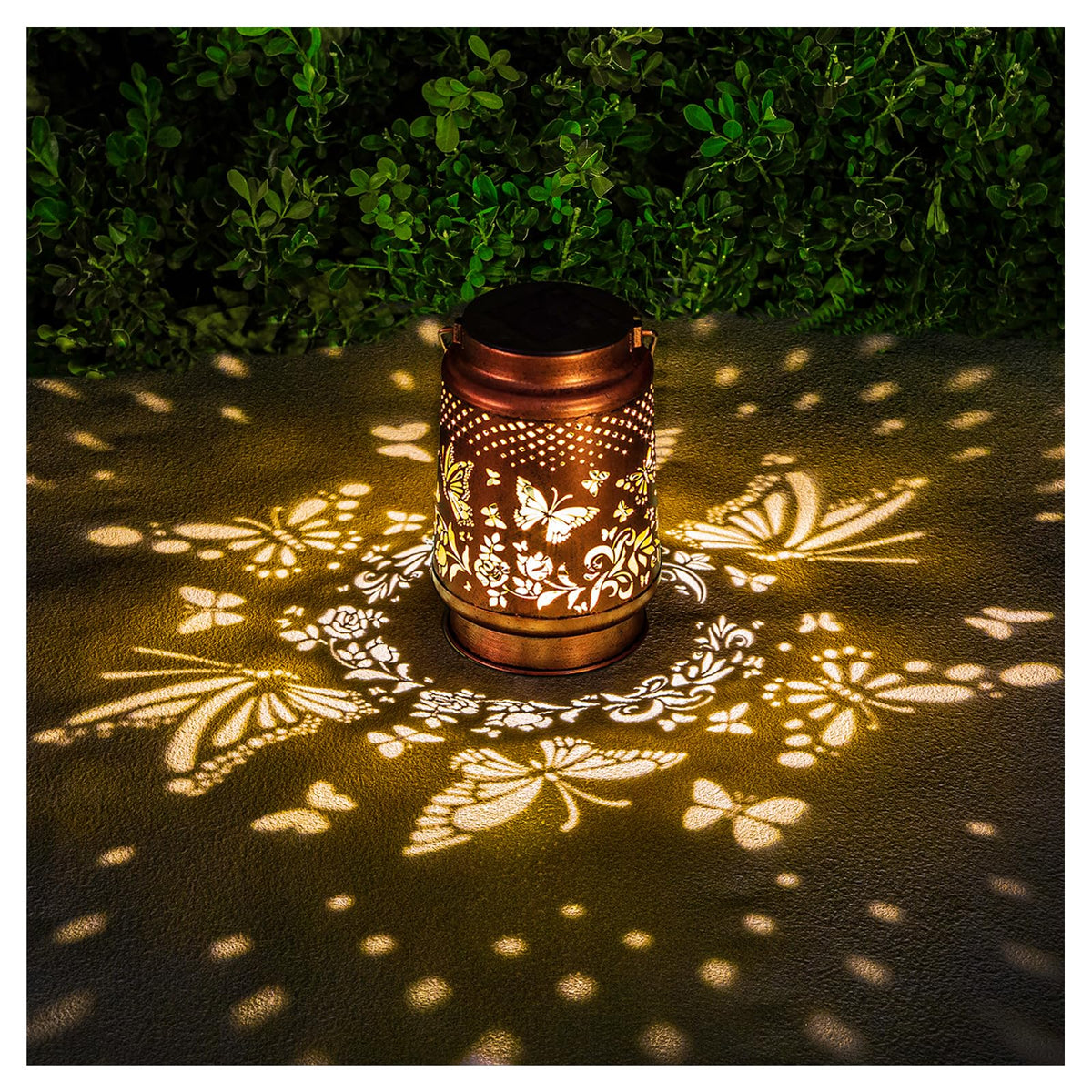 AITENISEN solar lantern butterfly garden decor casts a warm outdoor glow.