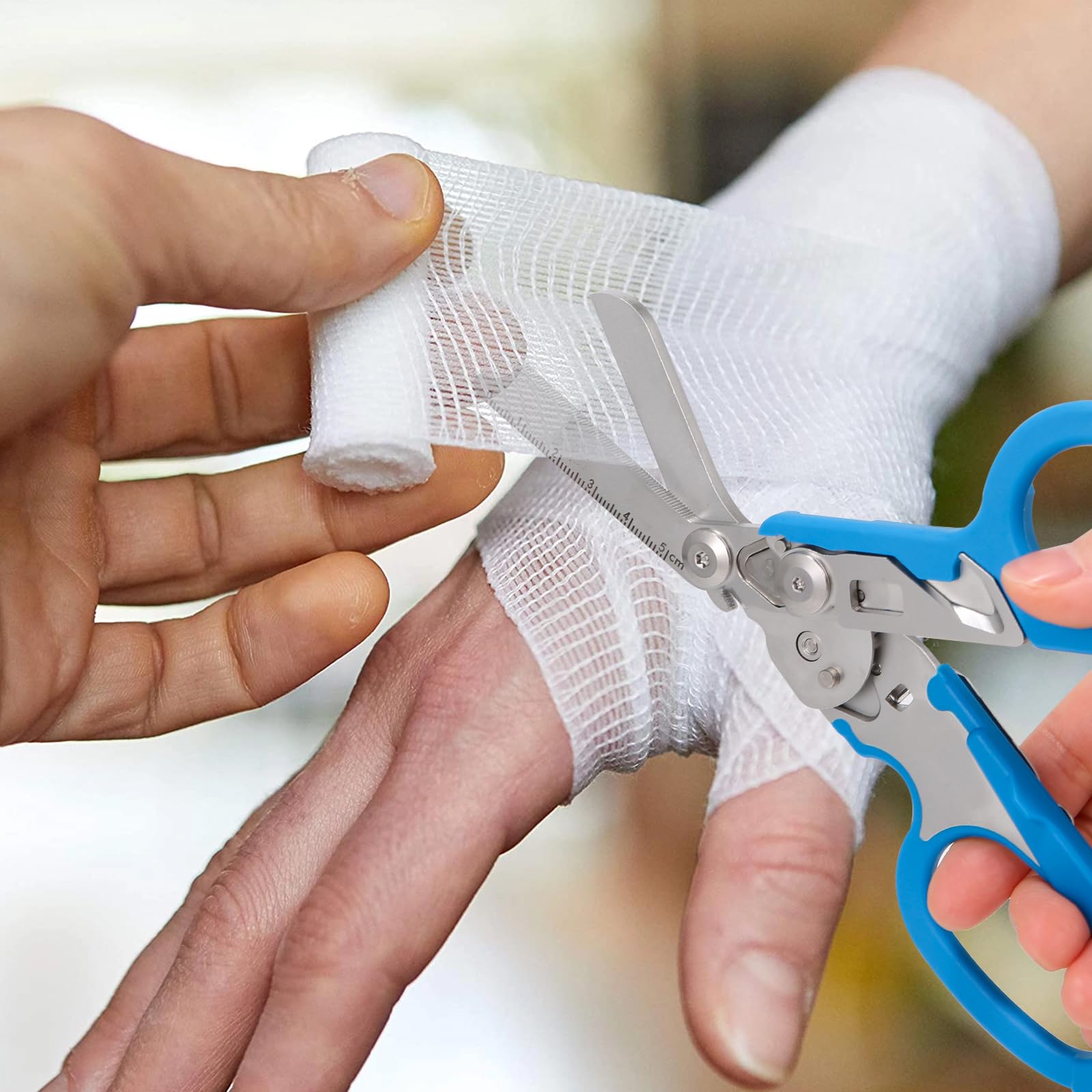 ALHML 6-in-1 trauma shears used as an oxygen tank wrench in an emergency setup