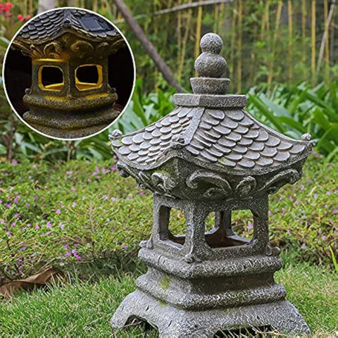 Aloak Asian Solar Zen Pagoda 14 inch glows at night, enhancing tranquil garden ambience.