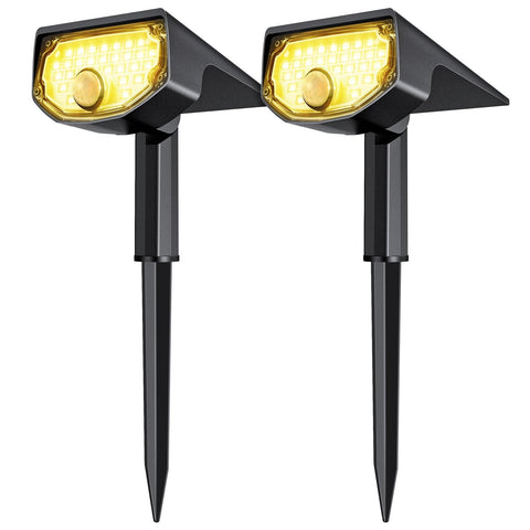 AloftSun solar motion sensor spotlight with 30 LEDs lighting a garden path.