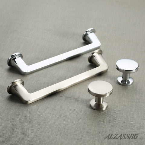 Alzassbg close-up of polished chrome knob, showing smooth finish and grip.