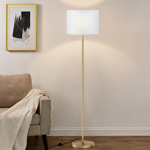 Ambimall 60-inch floor lamp with white shade and gold pole enhances a cozy living room ambiance.