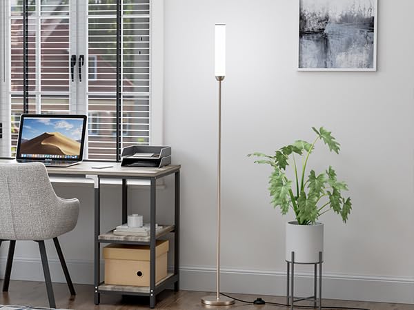 Ambimall floor lamp in a living room creating a broad ambient glow.