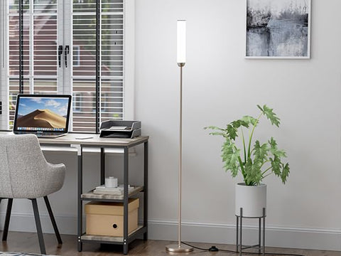 Ambimall floor lamp in a living room creating a broad ambient glow.