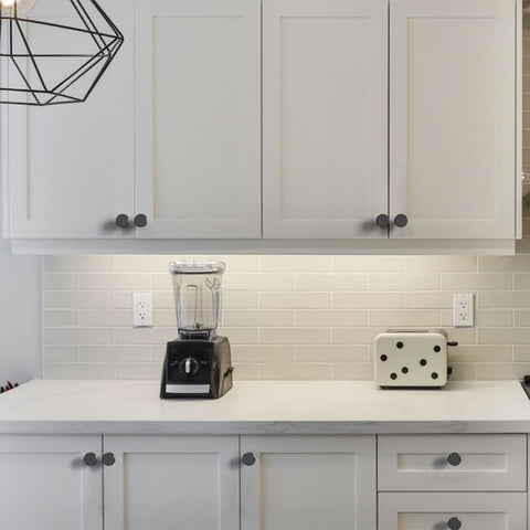 Amerdeco knob installed on a drawer, adding a modern matte accent.