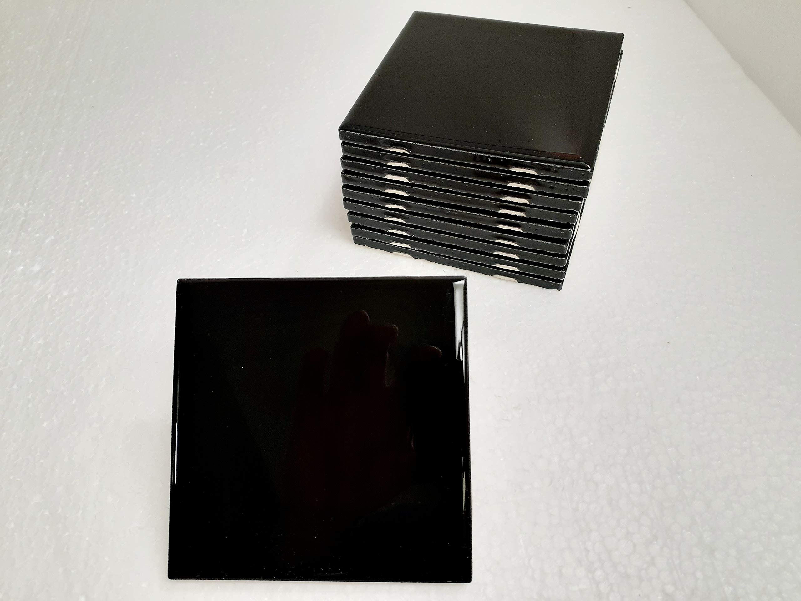 American Olean 4.25in black ceramic tile for a bold shower accent.