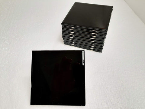 American Olean 4.25in black ceramic tile for a bold shower accent.