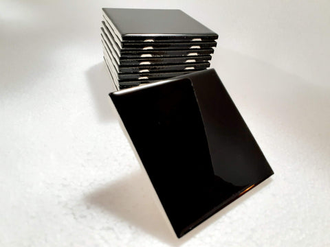 Backsplash design idea with American Olean glossy black tiles.