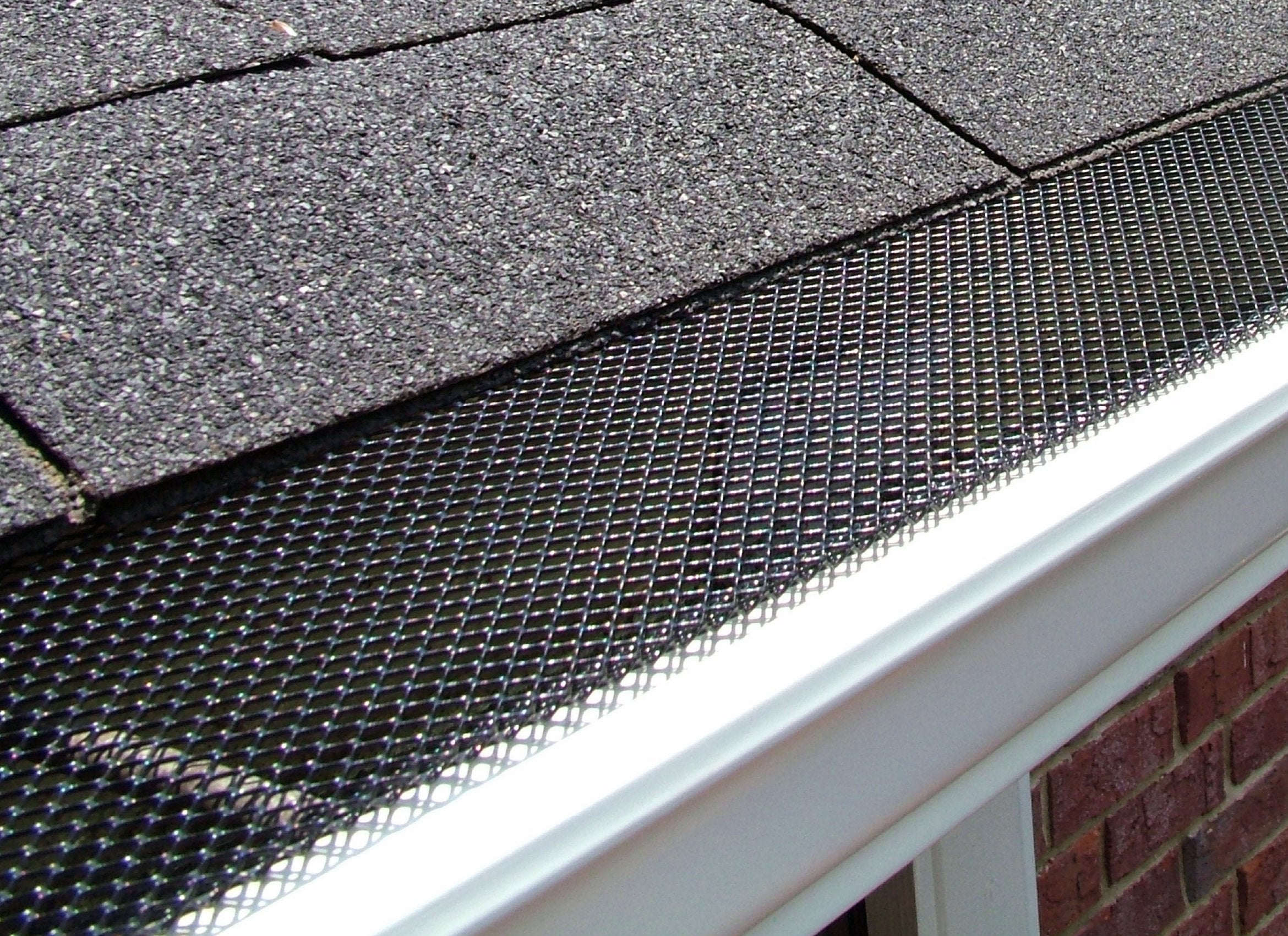 Amerimax Lock-In Gutter Guard mesh closeup showing debris-blocking design.