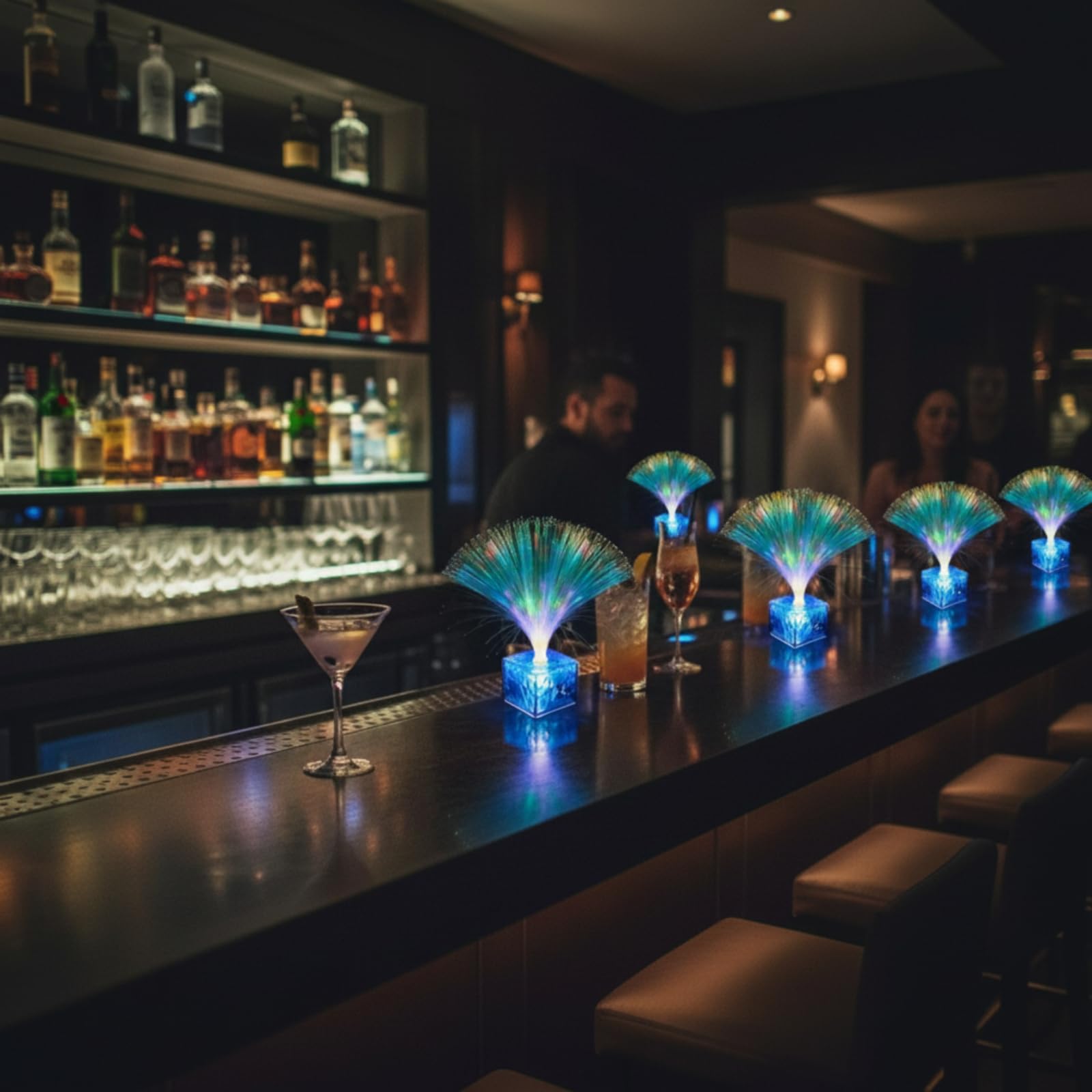 Amylove glow-in-blue fiber-optic centerpieces light aisles.
