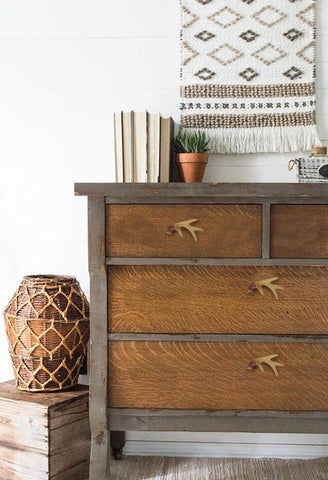 Amyoxu hand-painted resin antlers provide a unique cabinet accent.