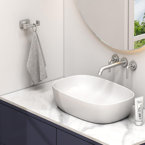 Angle Simple double-hook wall mount keeps towels and robes neatly.