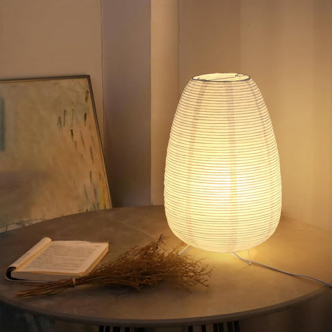 Anicompa rice paper desk lamp emits warm ambient light for focused work