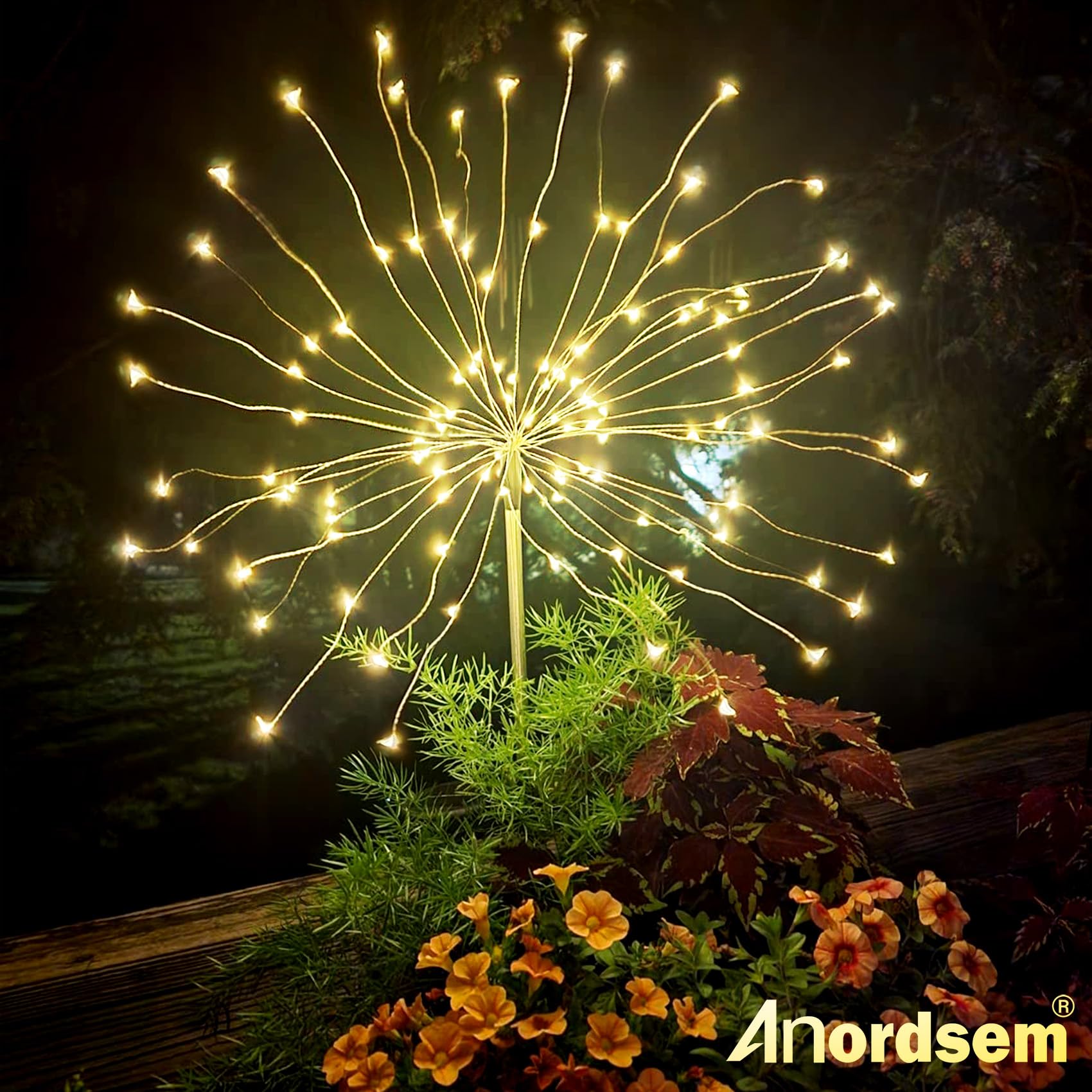 Anordsem firework beads along a flower bed create a magical garden look