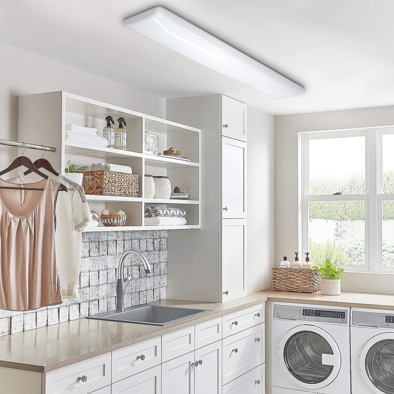 ANTLUX 4FT LED Puff Light low-profile flush mount in a modern laundry room.