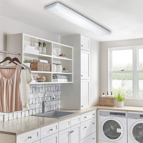 ANTLUX 4FT LED Puff Light low-profile flush mount in a modern laundry room.