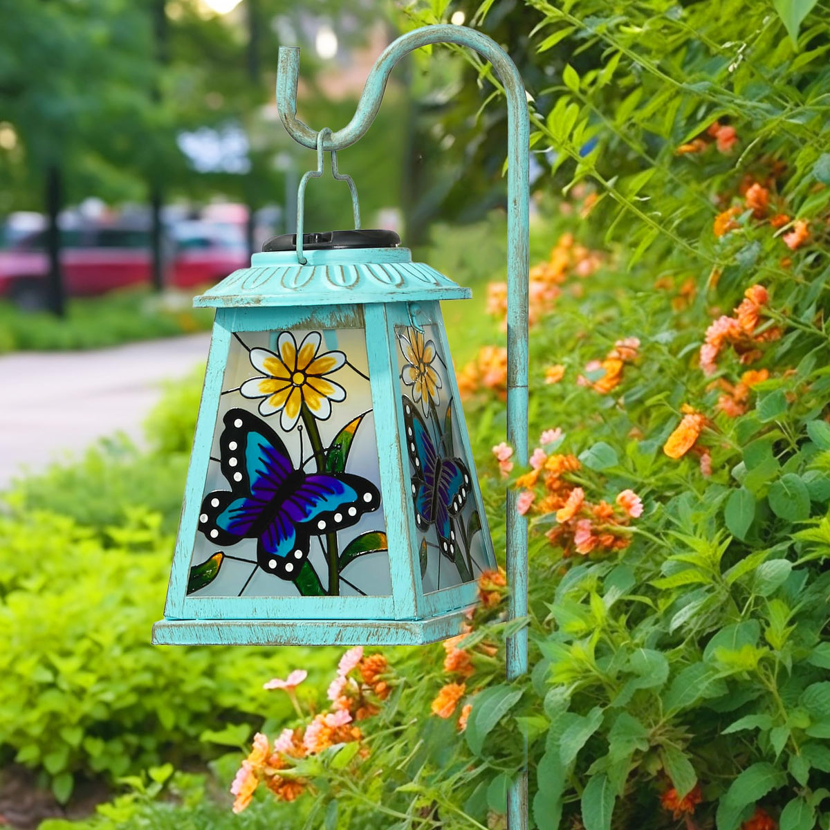 anyperfect butterfly solar lantern on a shepherd hook adds warm outdoor lighting