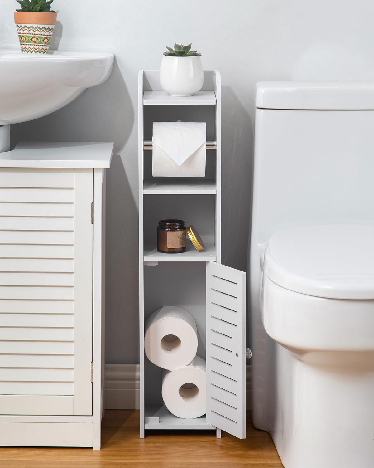 AOJEZOR Toilet Paper Holder Stand bottom tier stores rolls and cleaners.