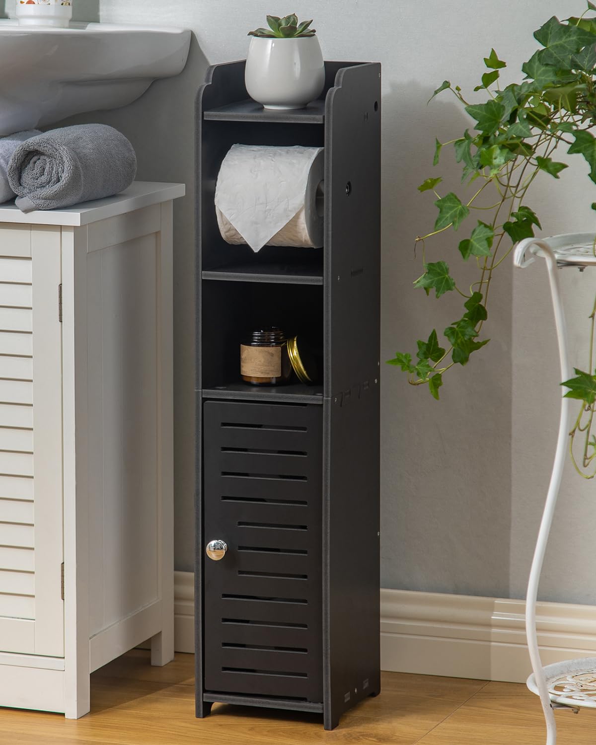 AOJEZOR Toilet Paper Holder Stand front view in a narrow bathroom, ideal for renters needing compact storage.