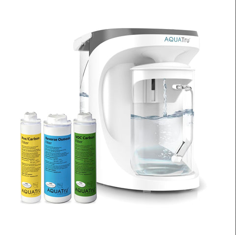 AquaTru carafe on countertop offers convenient purified water at hand.