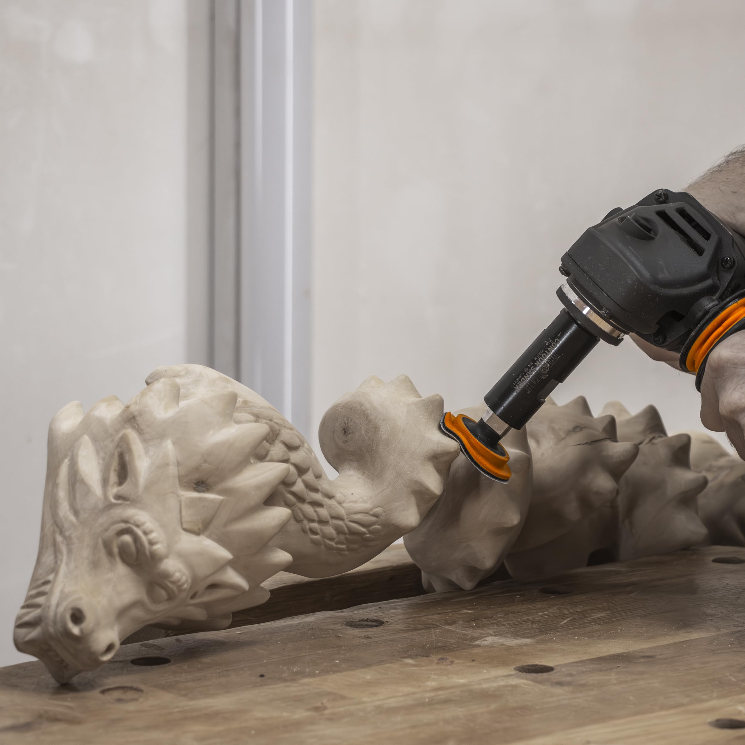 Arbortech Contour Sander sands internal curves while preserving grain details.