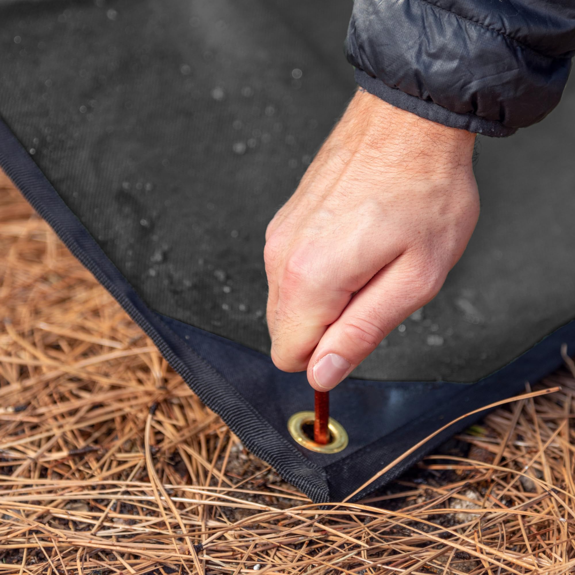 Staking grommets enable secure tie-downs for windy conditions with Arcturus tarp.