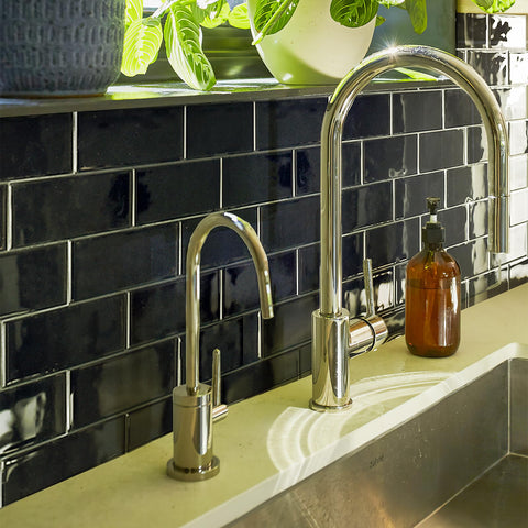 Art3d kitchen stove area backsplash illustrates waterproof, heat resistant surface.