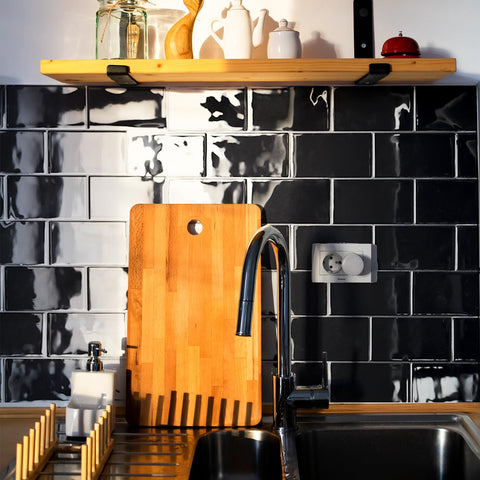 Art3d black backsplash wall with interlocking design for easy alignment.