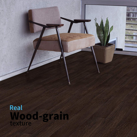 Art3d planks installed under cabinets using no-glue method.