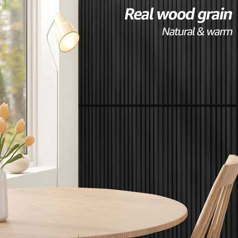 Art3d black WPC panel on living room wall for modern decor.