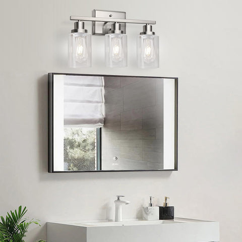 Three-light wall sconce offers broad wall coverage for mirrors or artwork.