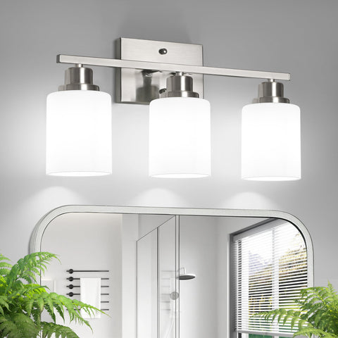 Ascher 3-light vanity with brushed nickel finish and milky glass shades for soft, even illumination.