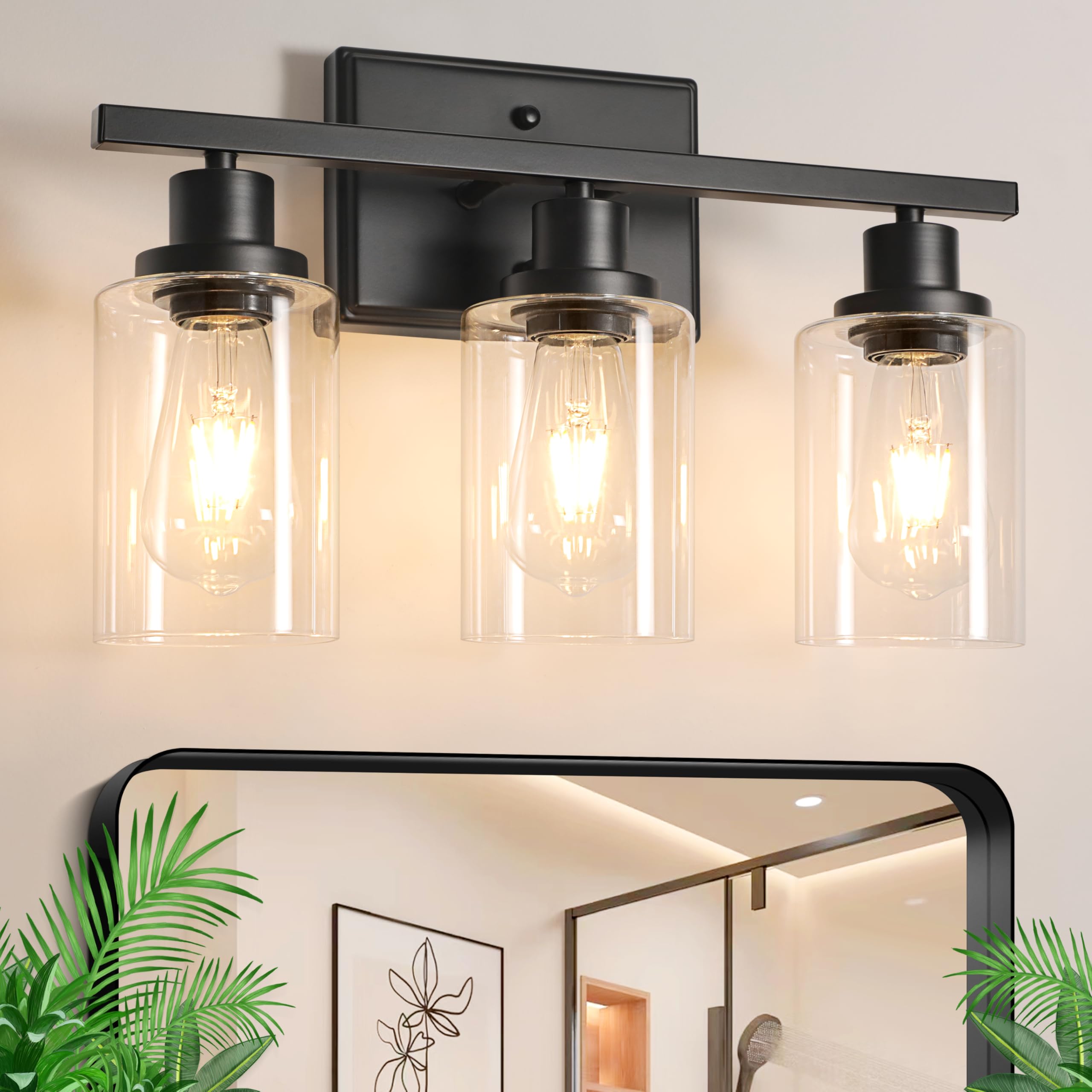 Ascher three-light vanity with clear glass shades for bright, even mirror lighting.