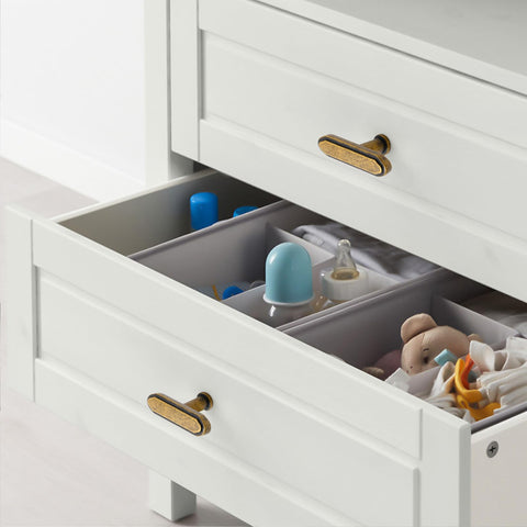 Asidrama brushed antique brass knob detail emphasizing durable metal finish.