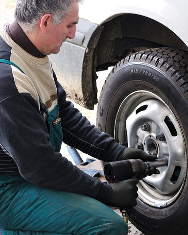 Gloved hand wearing Black Lightning for mechanic and workshop use.