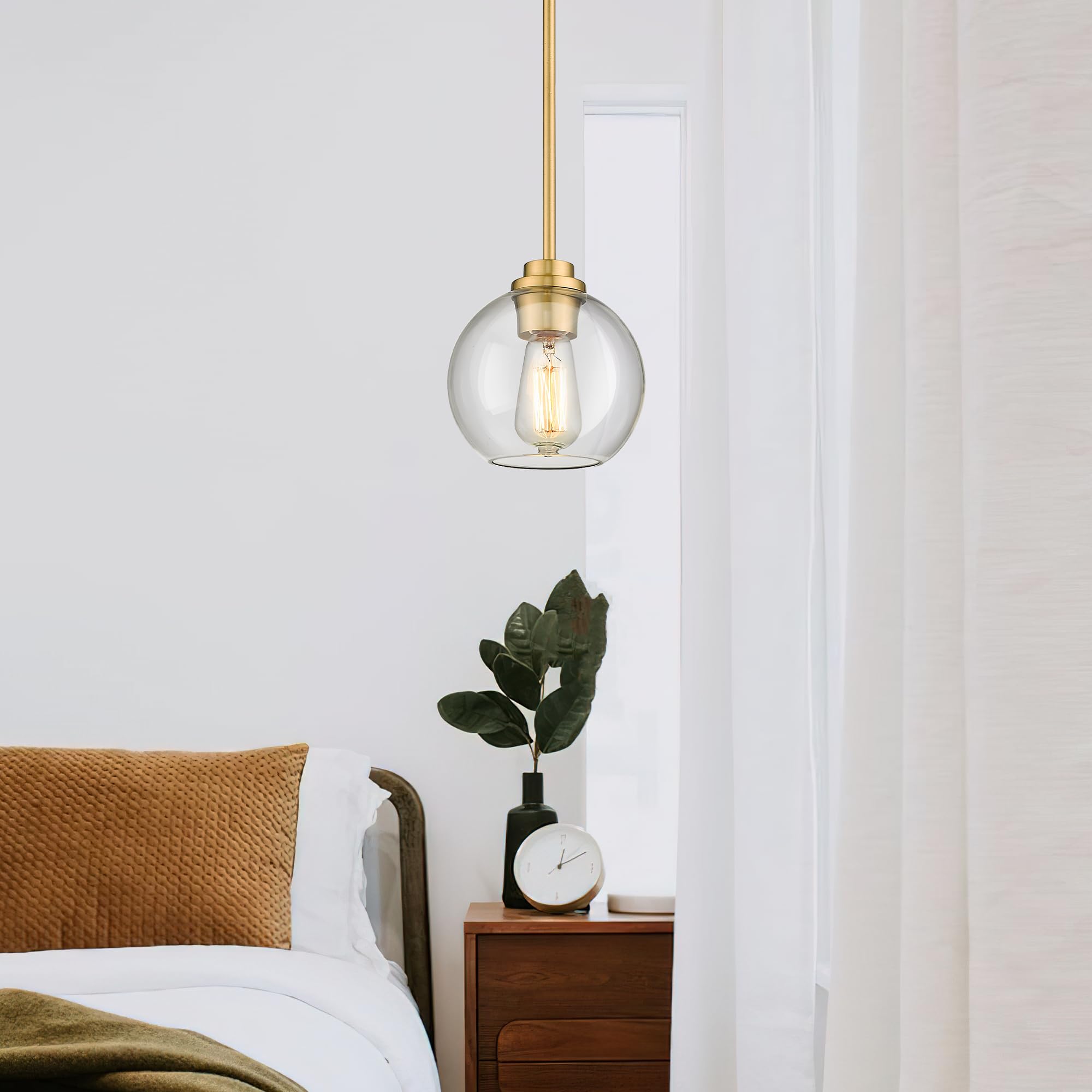 Audickic brass pendant light with gold canopy adds warm farmhouse style over dining space.