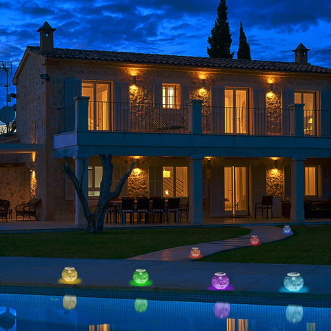 Aukora solar-powered garden lamp glowing at dusk