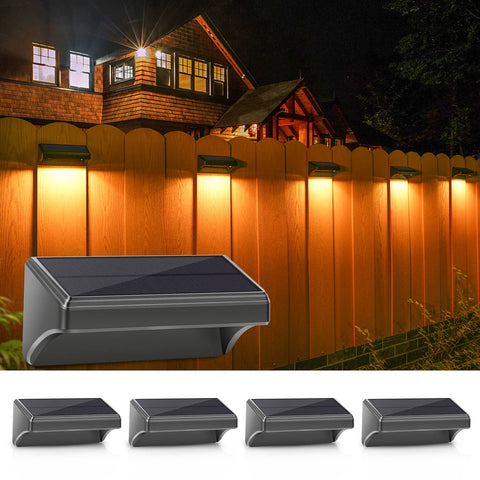 Aulanto solar fence light plus 4-pack mounted on wall for durable outdoor lighting.