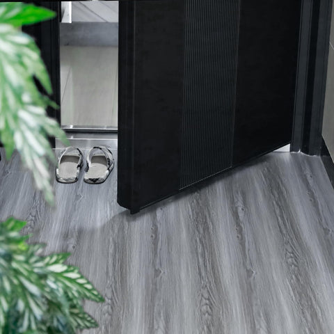 auxua roll-up floor tiles demonstrating easy handling and compact storage.