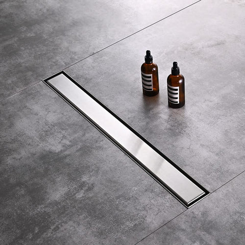Tile-in pattern drain cover from AVSIILE showing seamless integration.